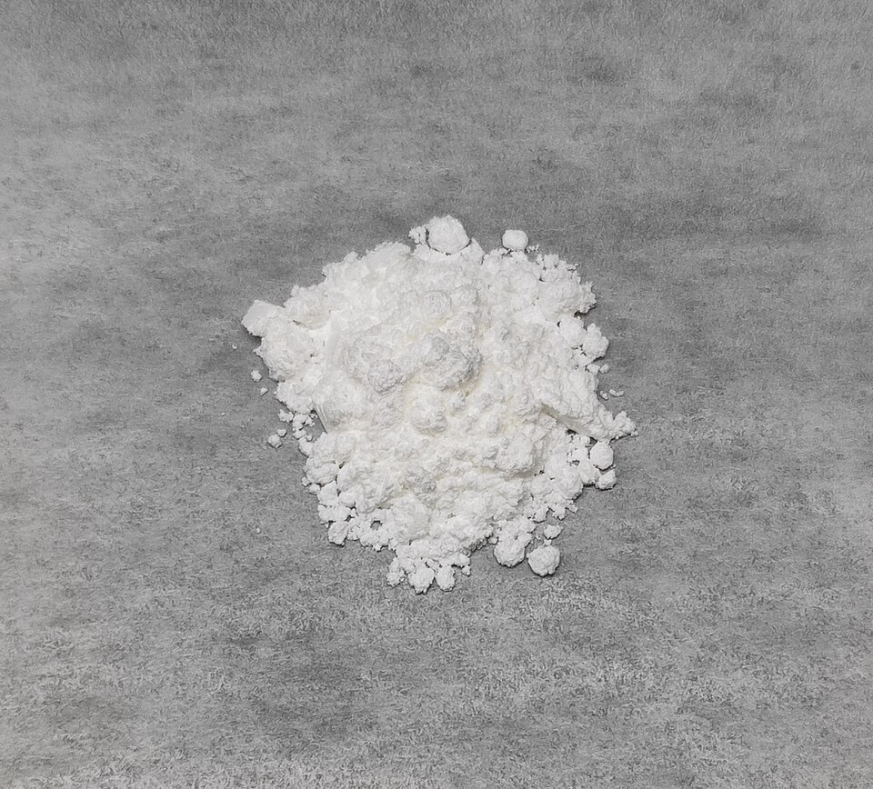 Photograph of zinc gluconate hydrate powder.